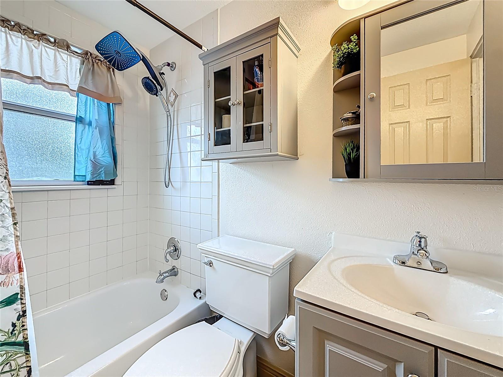 Another view of the full bath on 2nd floor. The window faces the back yard. Vanity & cabinets were installed in Nov 2025.