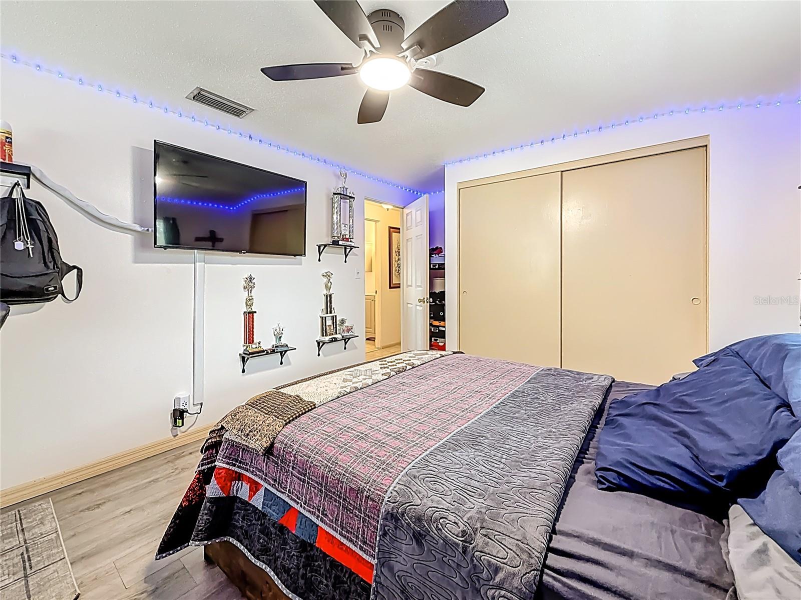 Another view of the 2nd bedroom upstairs. In the view, the entrance and the wall closet are visible. YOu may have also notice the location of the full bath in the hall.