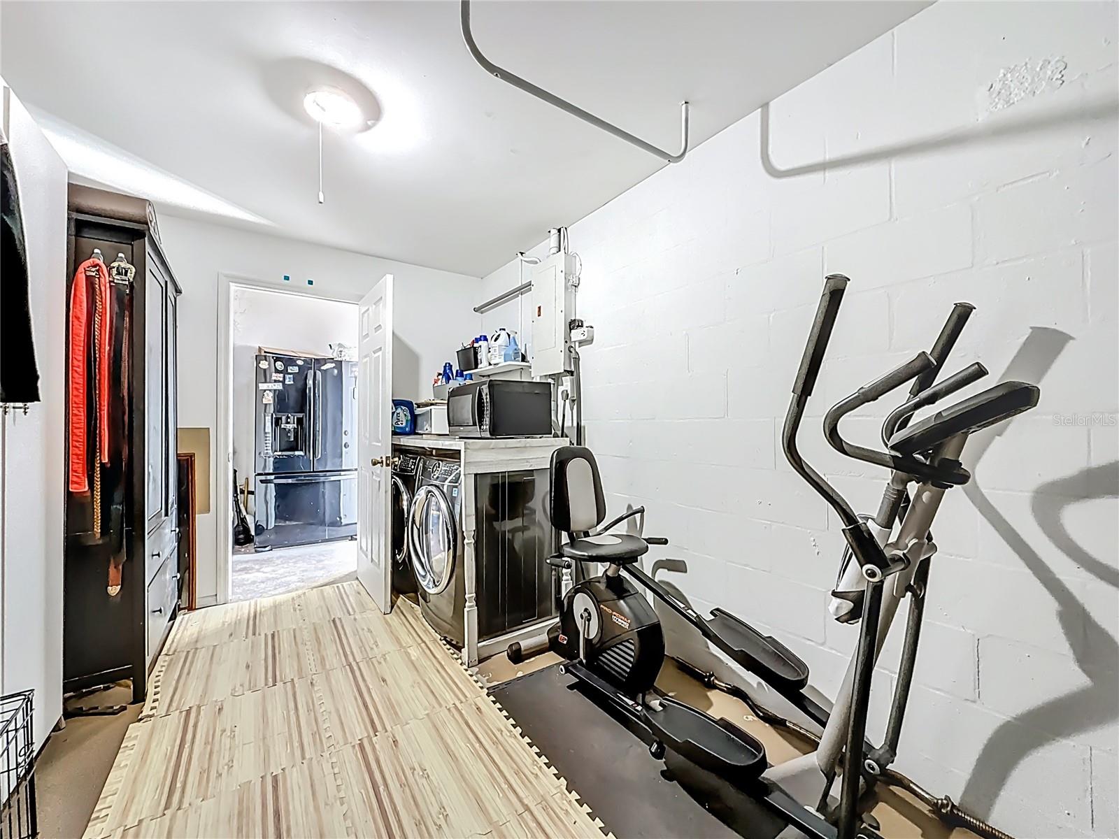 Another view of the laundry room in the garage.