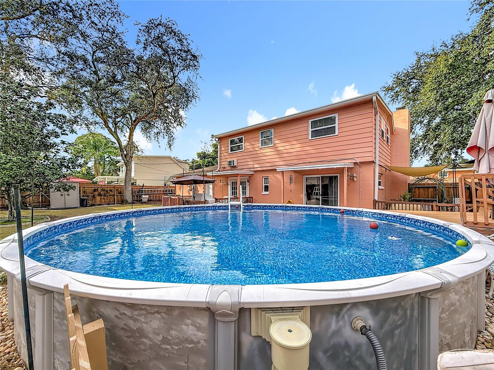 In THIS view, while you may think it's about the pool, it's actually to show you the location of the raised bed garden on the right side of the house. The sail shade helps cover your growing veggies and herbs during the hottest times of the day.