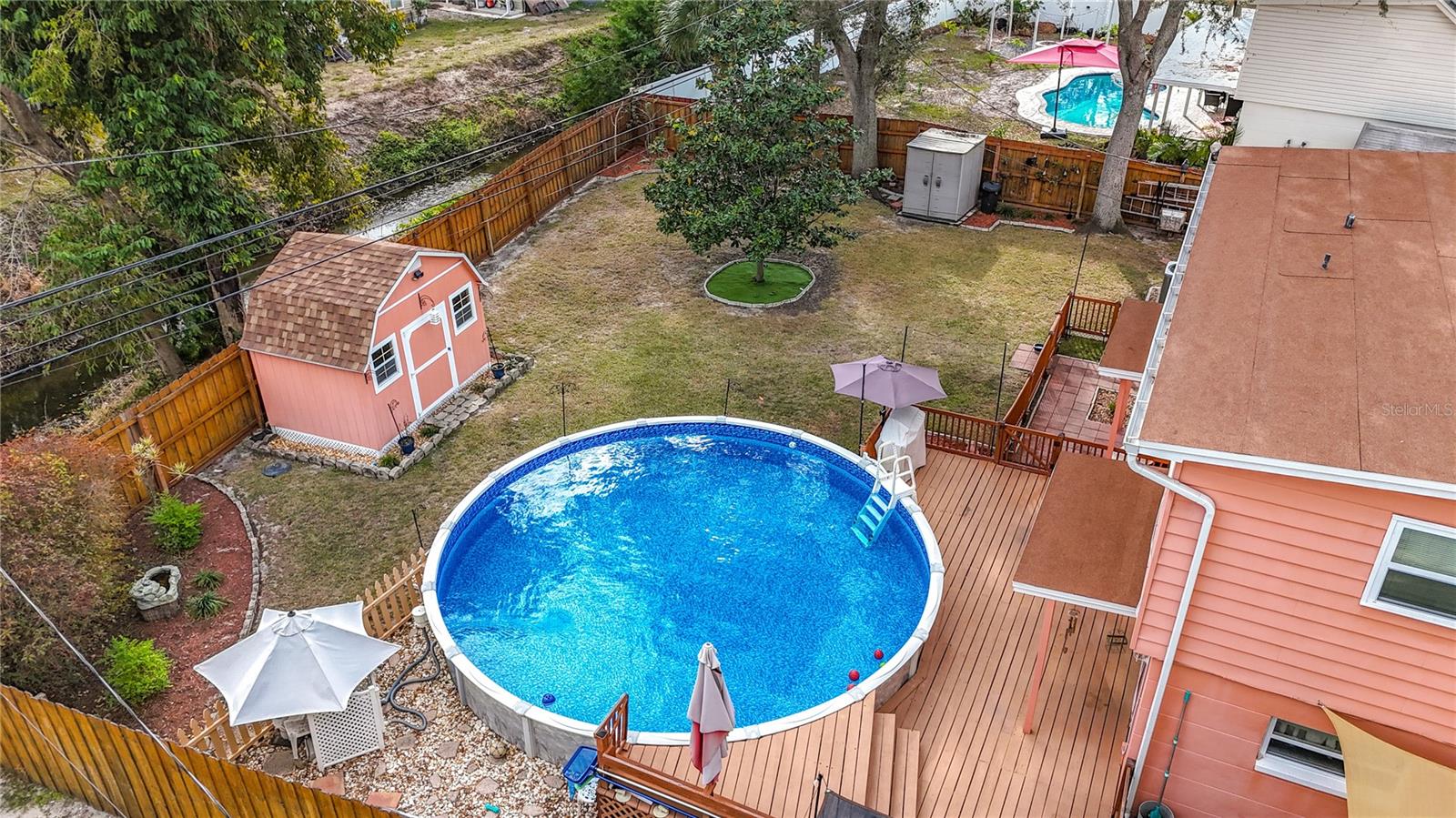 Look at all that space! Lot is 72' Wide by 100' Deep. Long Branch Creek is visible on your left, beyond the fence.