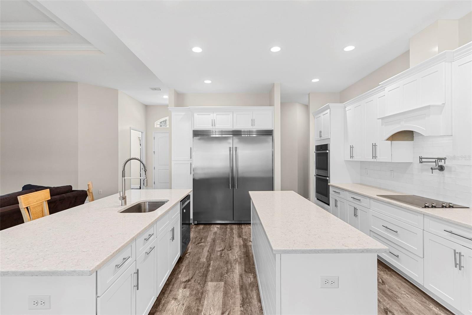 Double-door professional-grade refrigerator and extensive counter space provide everything needed for daily meals or entertaining