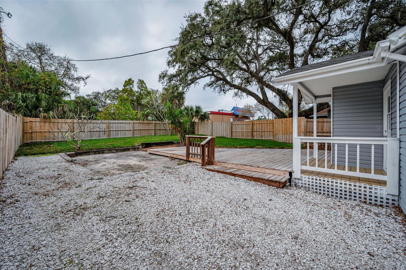 Back side yard behind gate-space to park trailer or boat