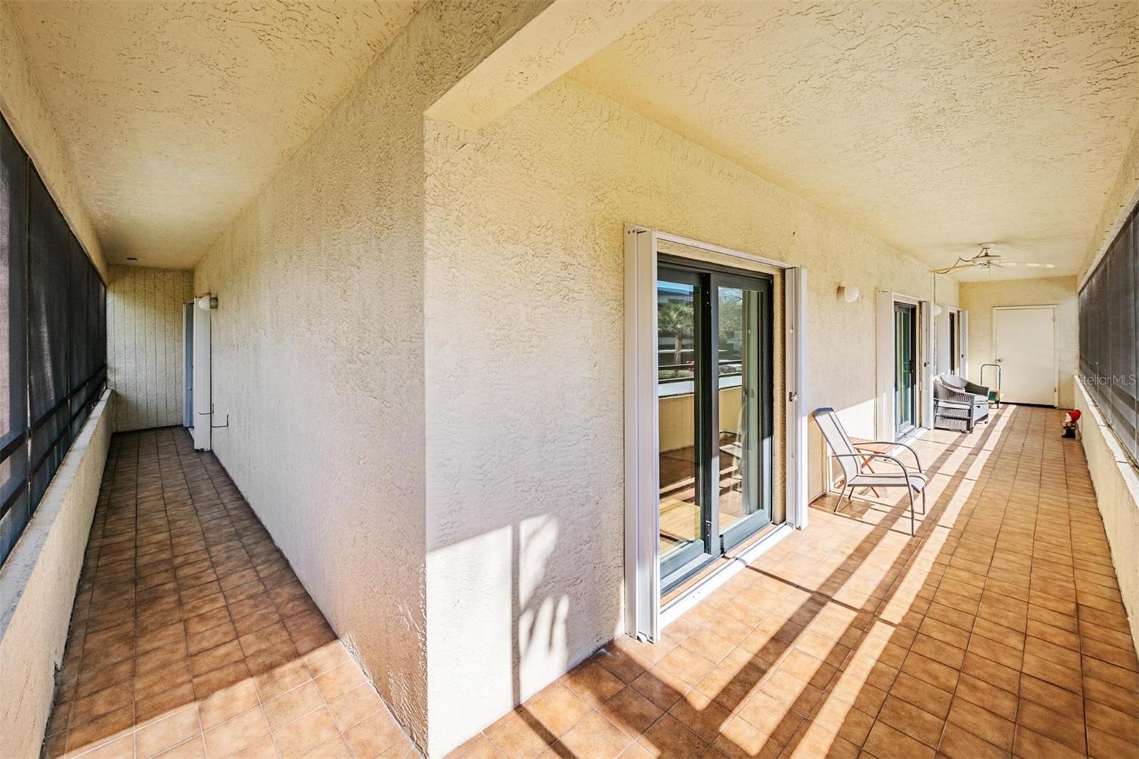 This corner unit has an enormous, screened tile patio with outdoor access from each room. Plenty of space to enjoy the view while having coffee, lunch or dinner.