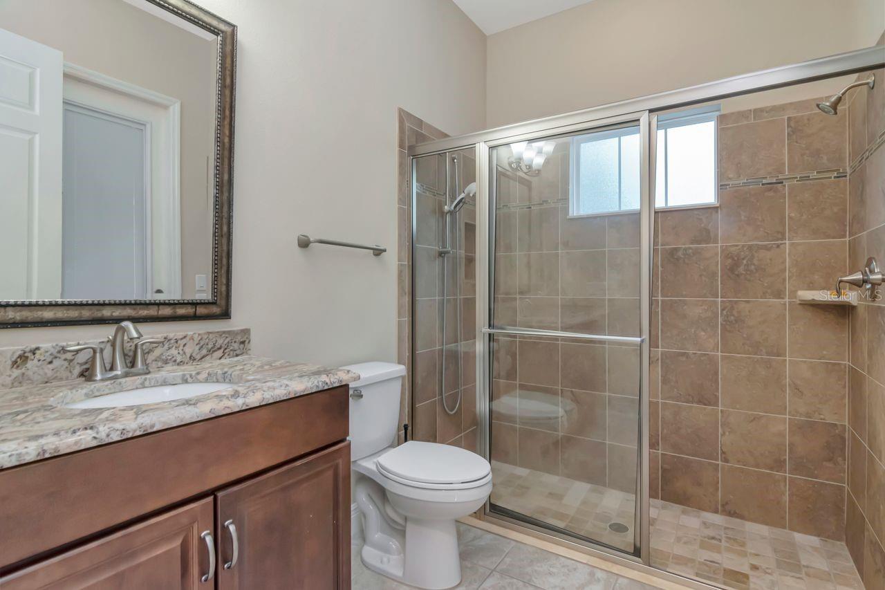 Spacious Pool Bath with Convenient Lanai Access