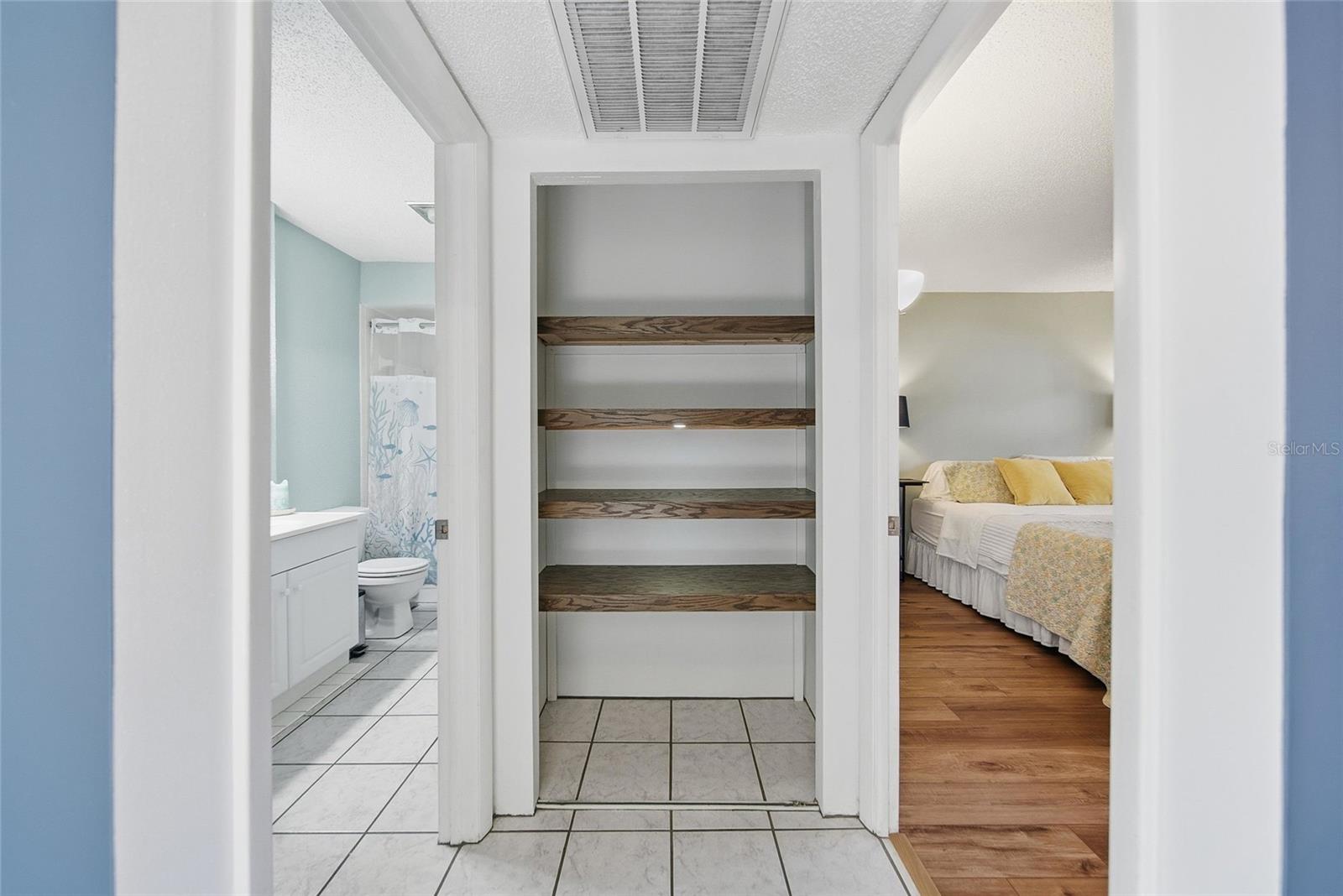 Hallway closet with custom shelving
