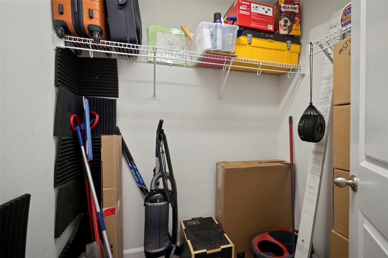 Extra storage closet off the primary bedroom and bath.