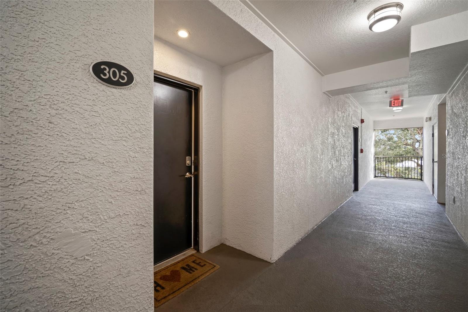 Front door and hallway, 305 is a corner unit