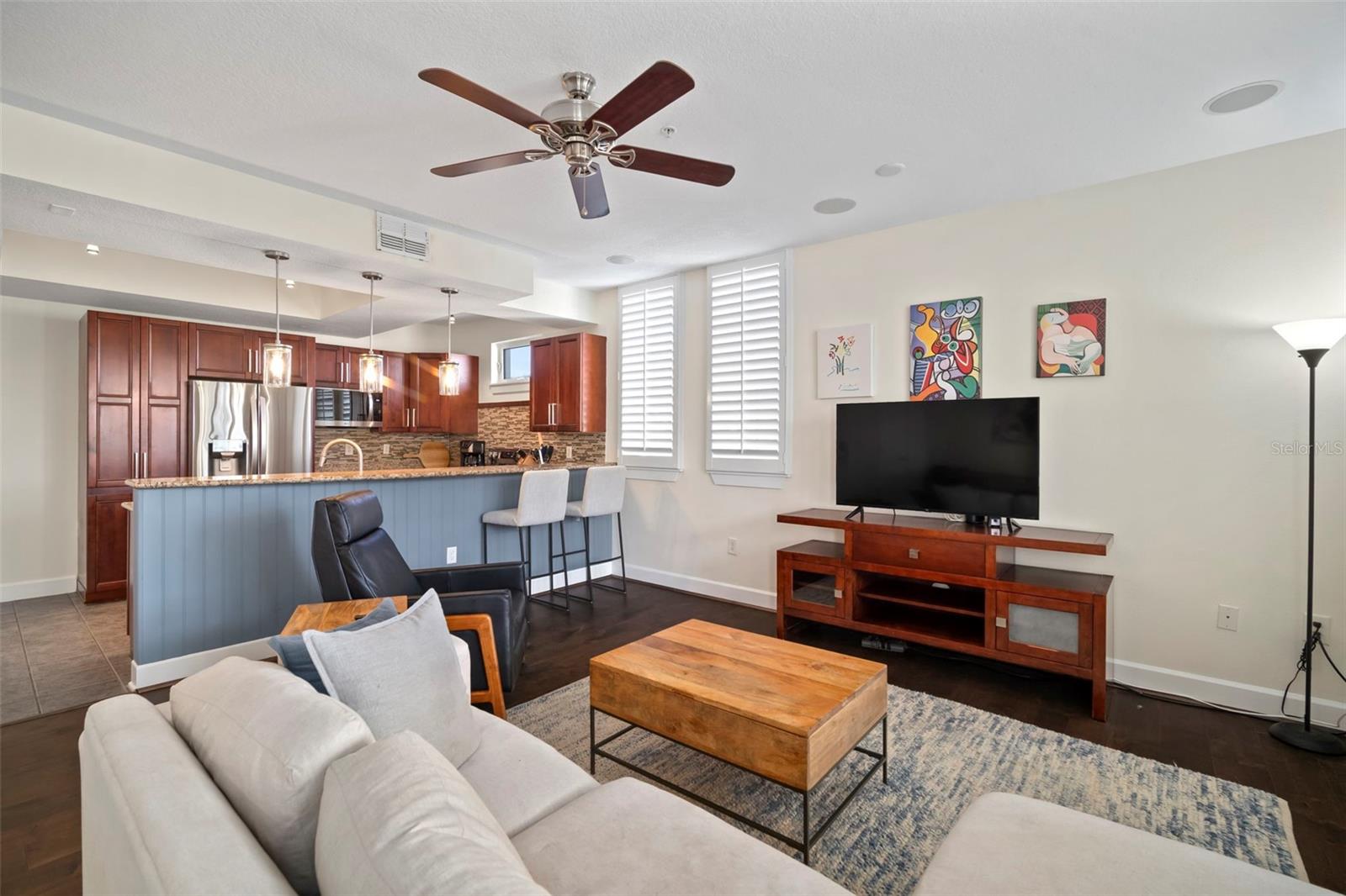 Great Room looking to kitchen, engineered hardwood floors.