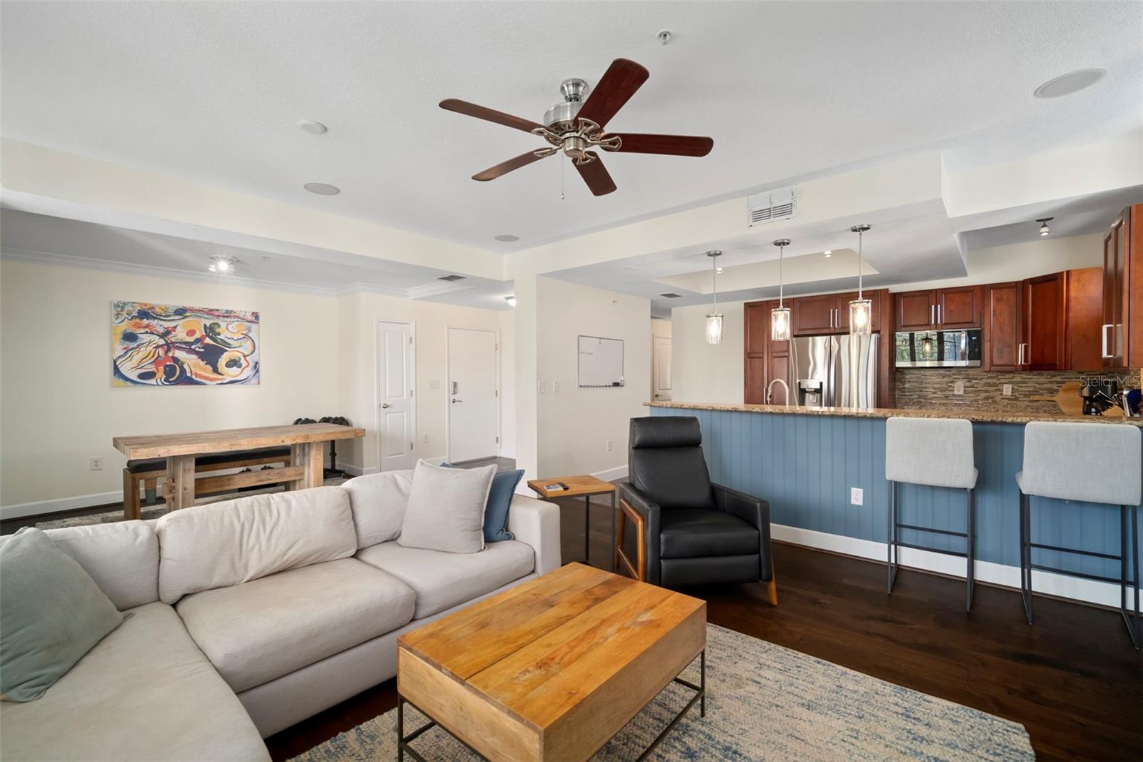 Great room looking back to front door and kitchen