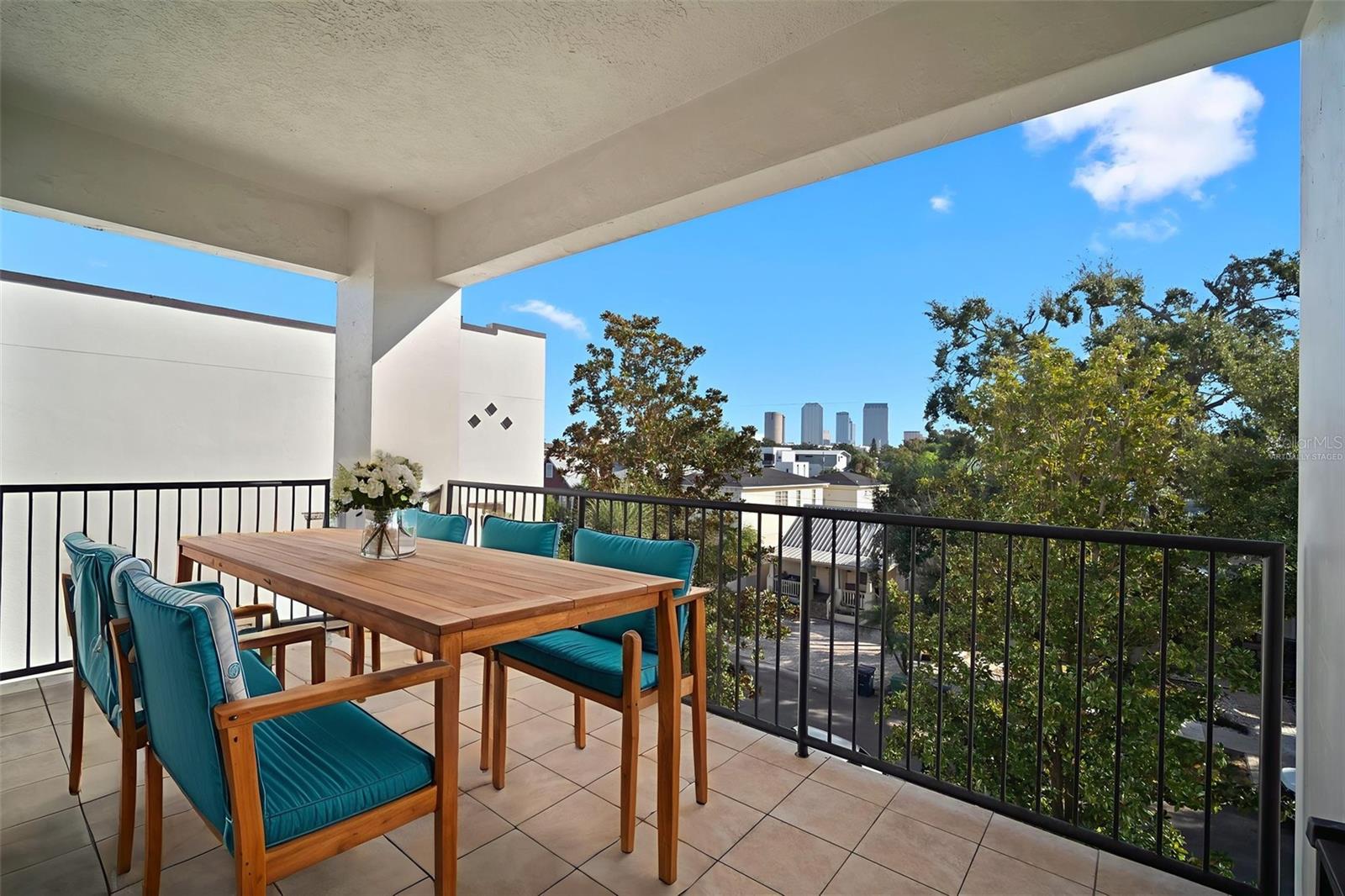 Virtually staged photo looking at the spectacular city view. Buildings appear to change colors at sunup and sunset.