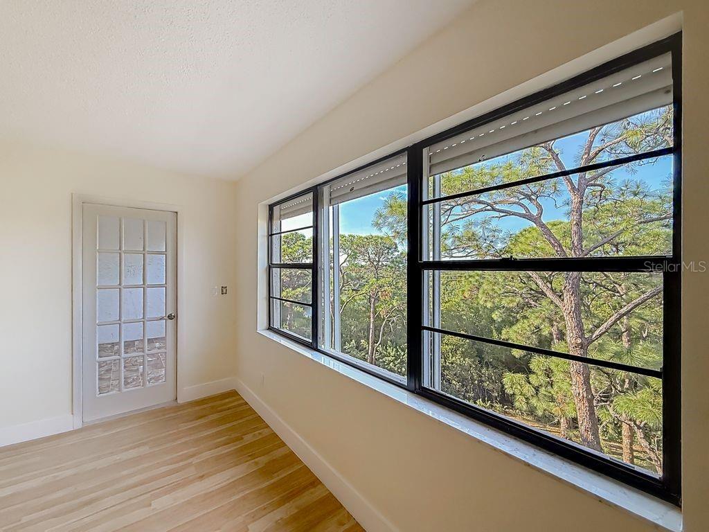 Family room has wall of windows for gorgeous sunsets facing West.