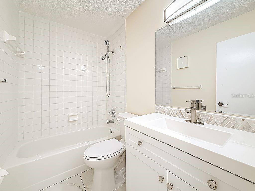 Hall bath has tub/shower and new vanity, toilet, mirror, lights...