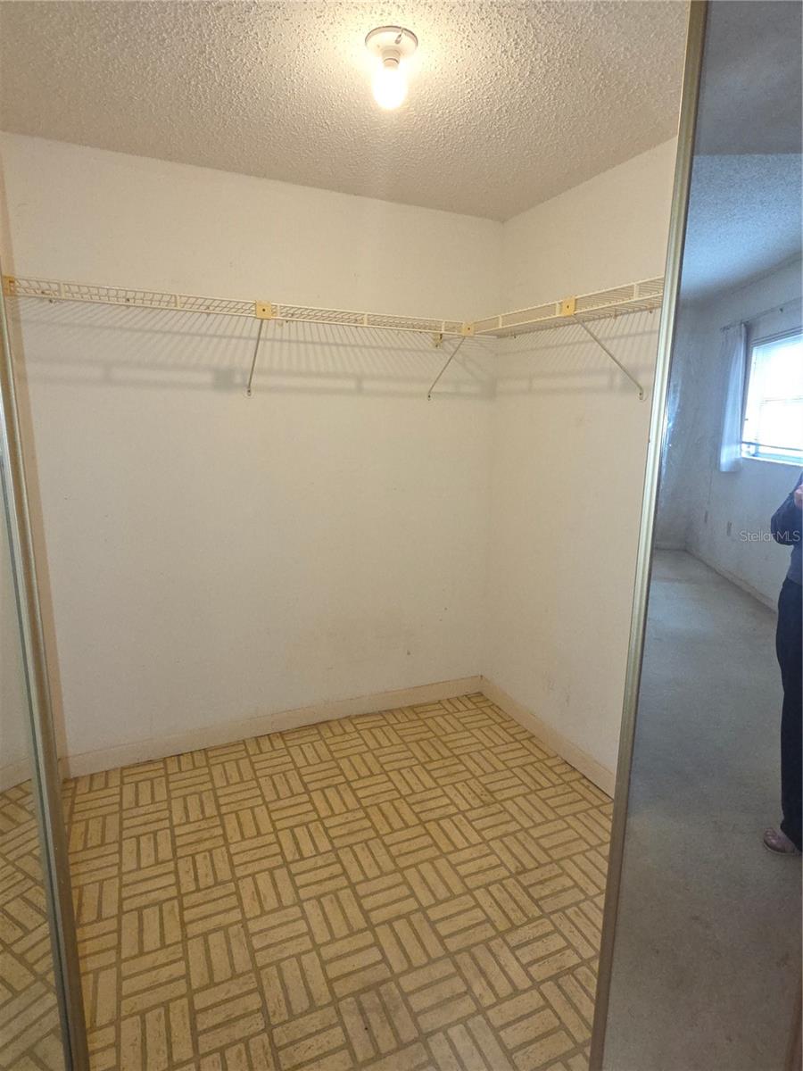 Primary walk in, one of 2 closets