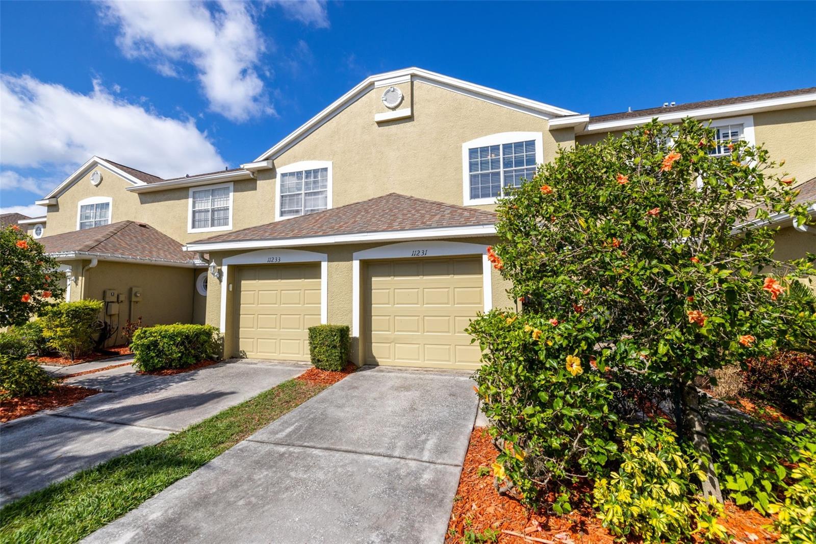 Front of townhome with tropical plants