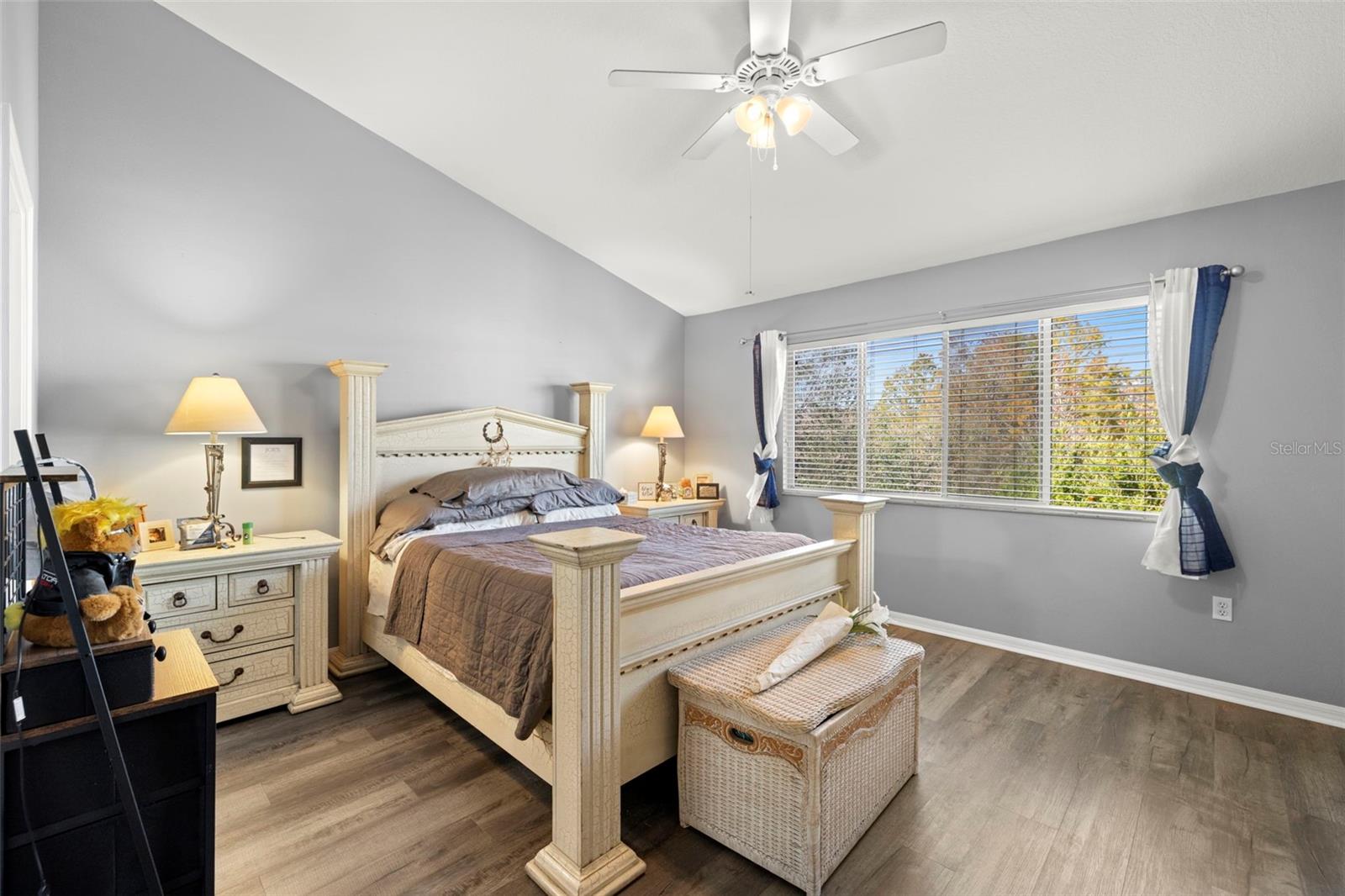Primary bedroom with vaulted ceiling