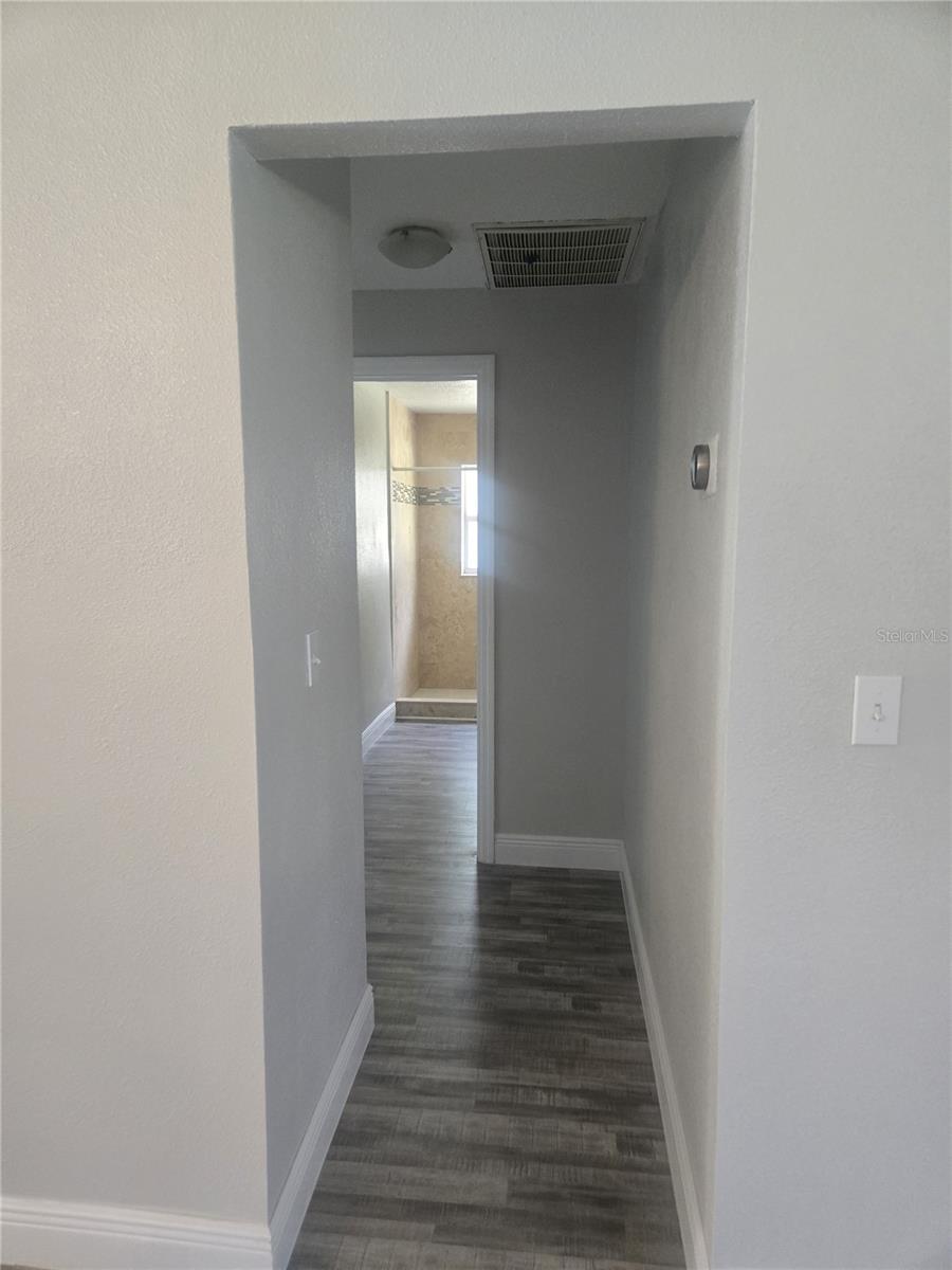 Hallway toward bathroom and bedrooms 2 and 3