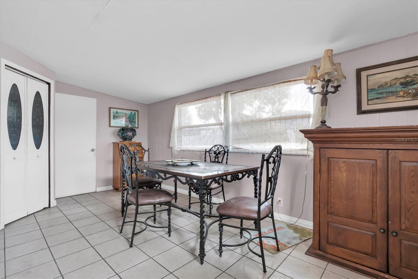 Dining room or can be used as a Florida room. Large pantry w/double doors to the left. Exit out to the back yard and laundry room straight ahead.