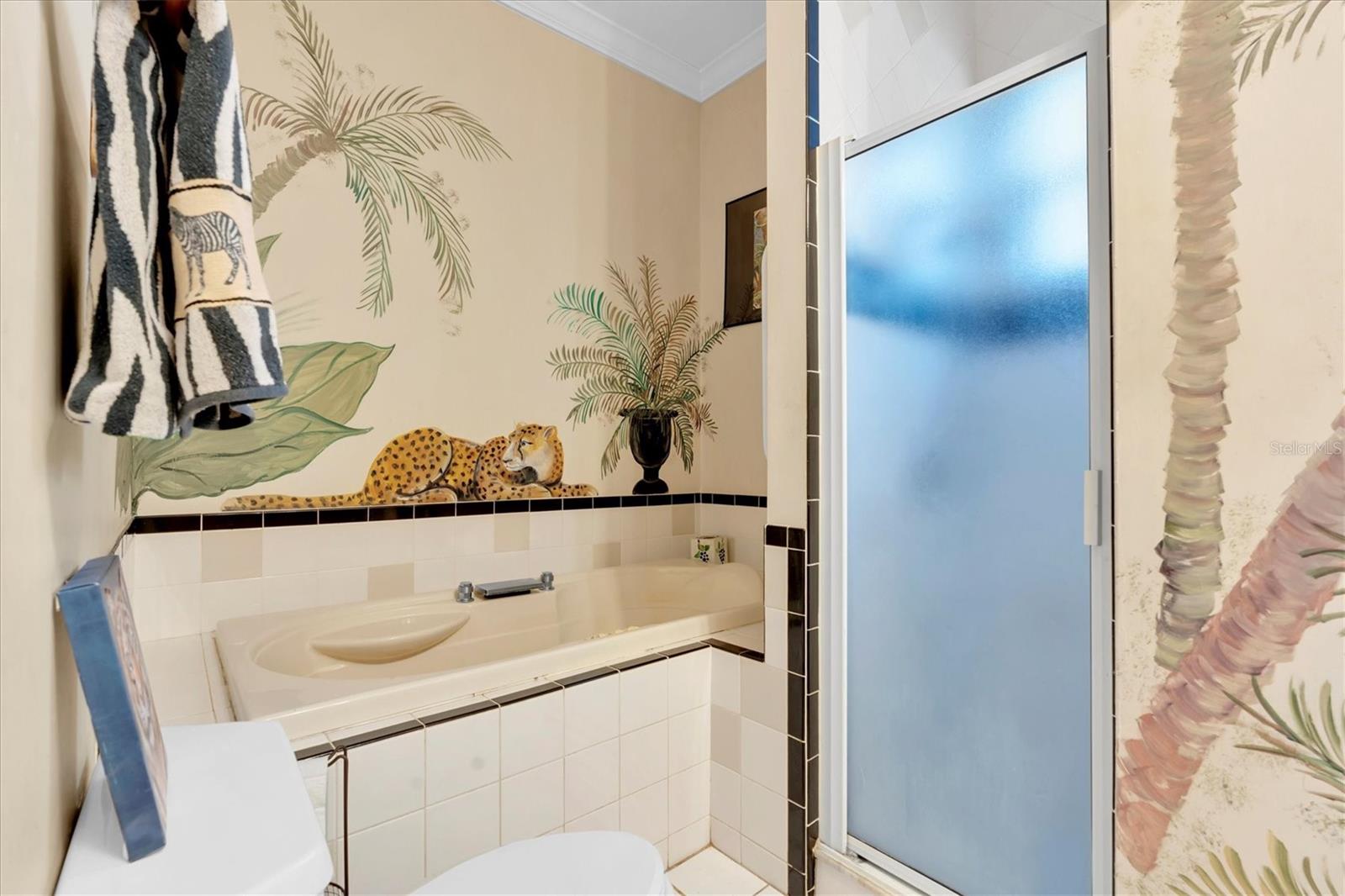 Large jet tub and walk in shower.