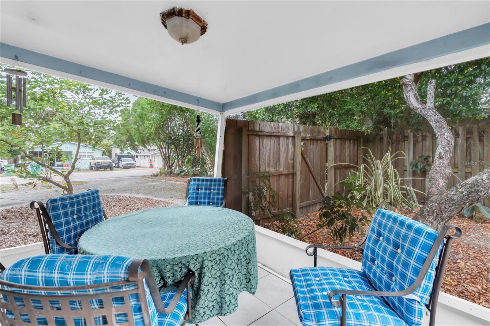 Screened in covered porch, located outside the living room.