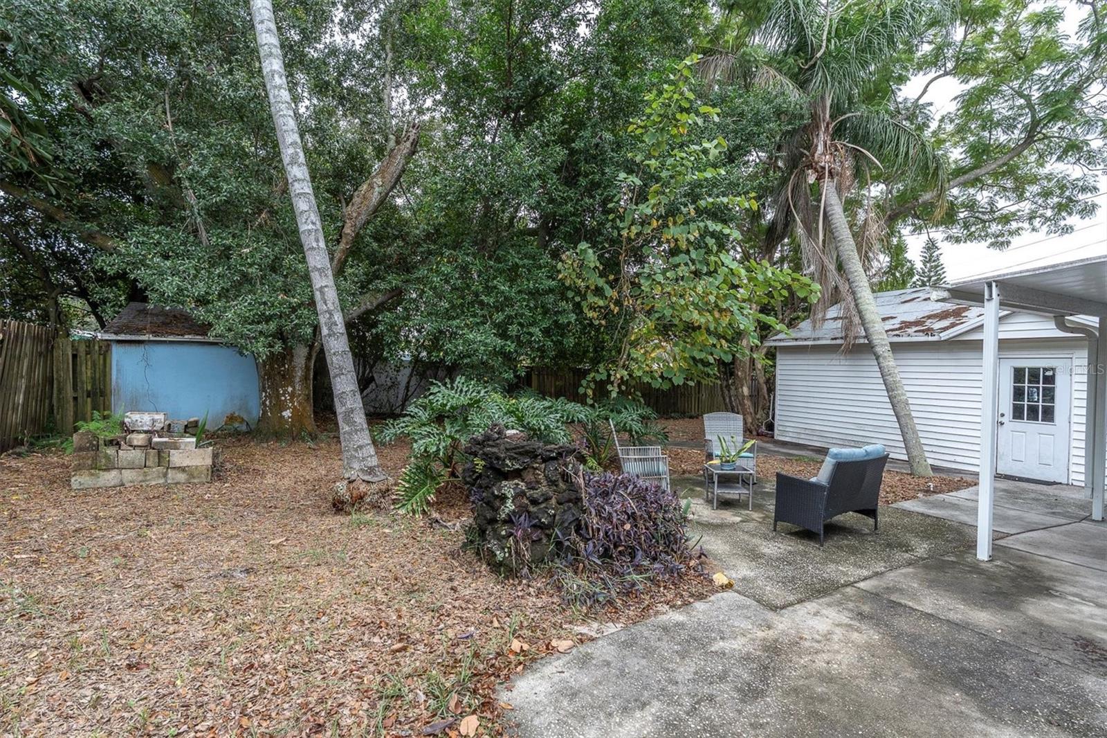 View of the back yard & Side view of the garage.