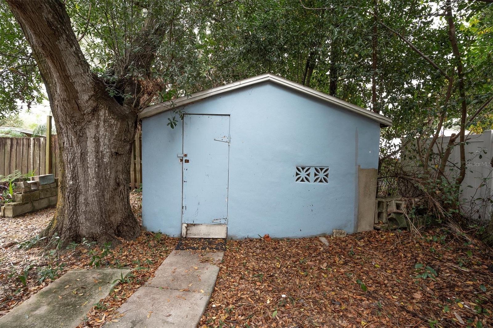Additional shed, storage or workshop area with electric hookup.
