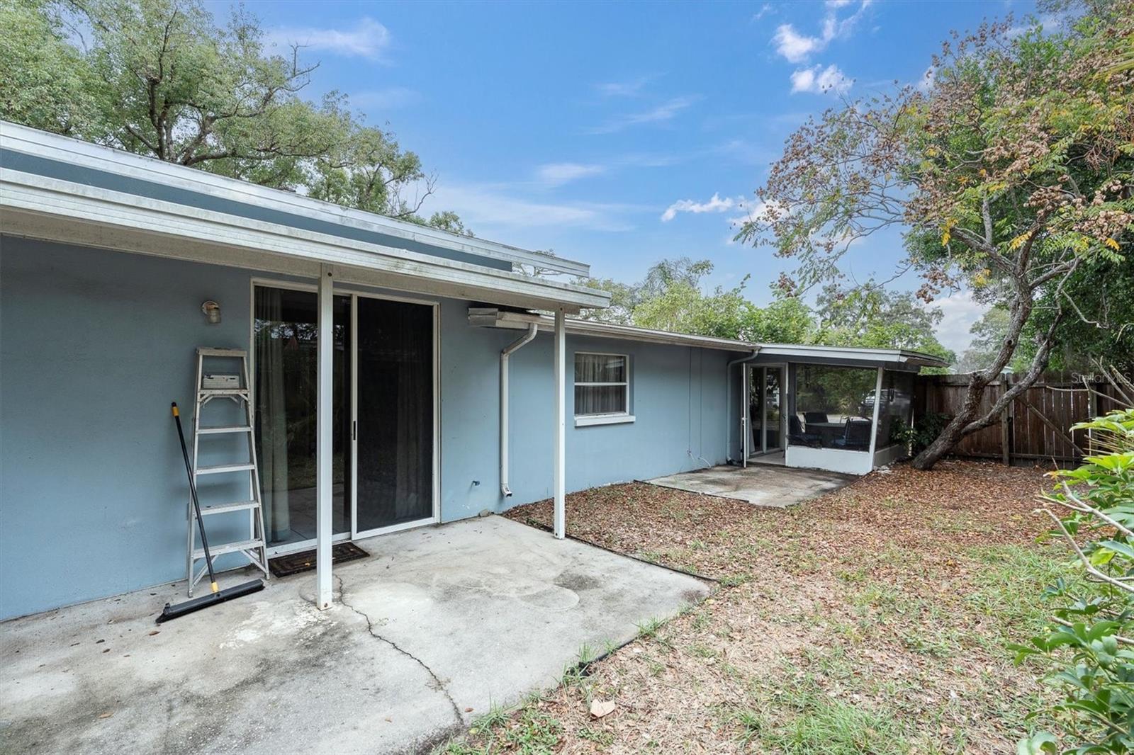 Master to the left & includes a covered porch. Enclosed porch at the front of the home and enters into the Living room.
