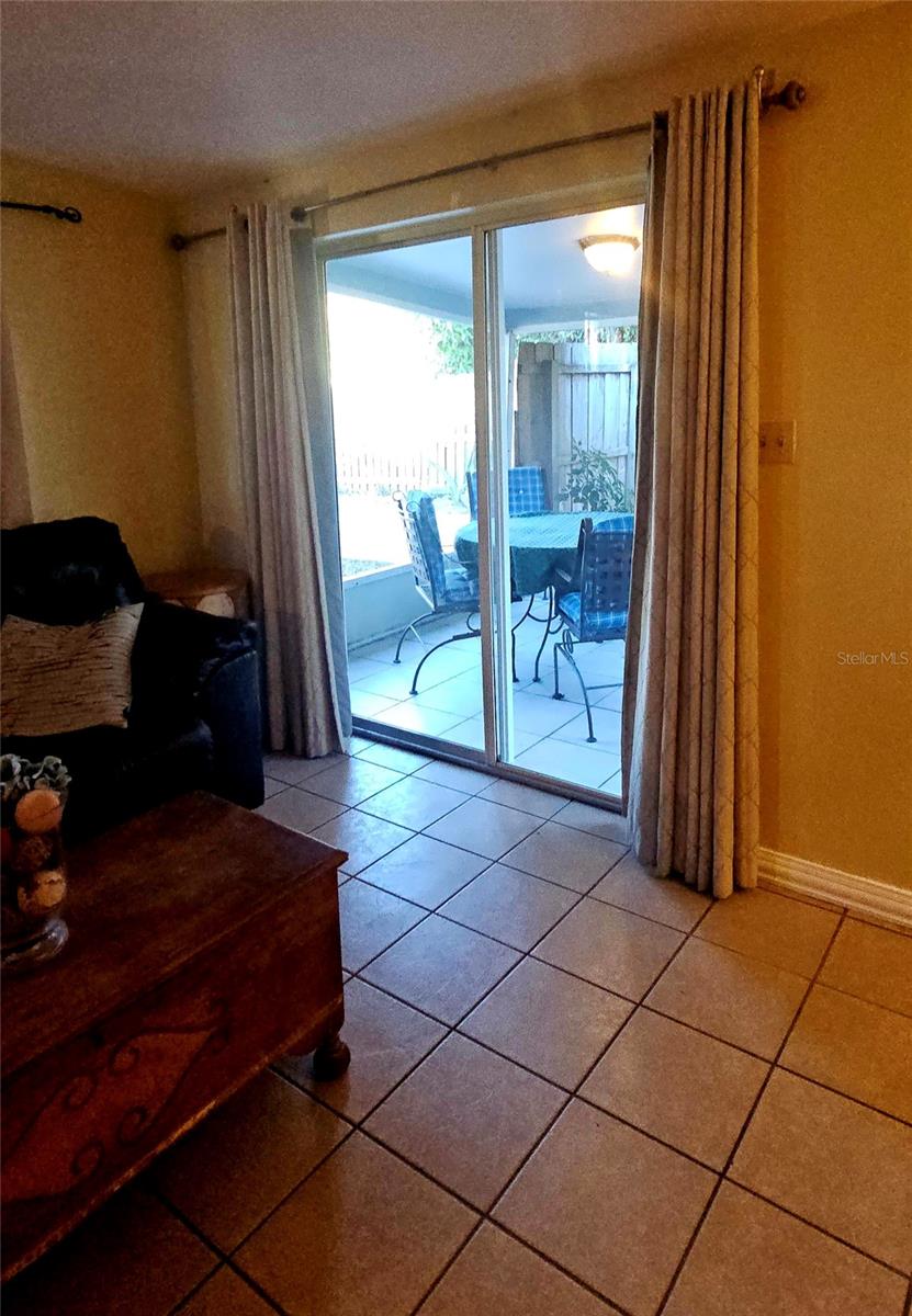 Sliding glass doors in the livingroom  to the screened in porch