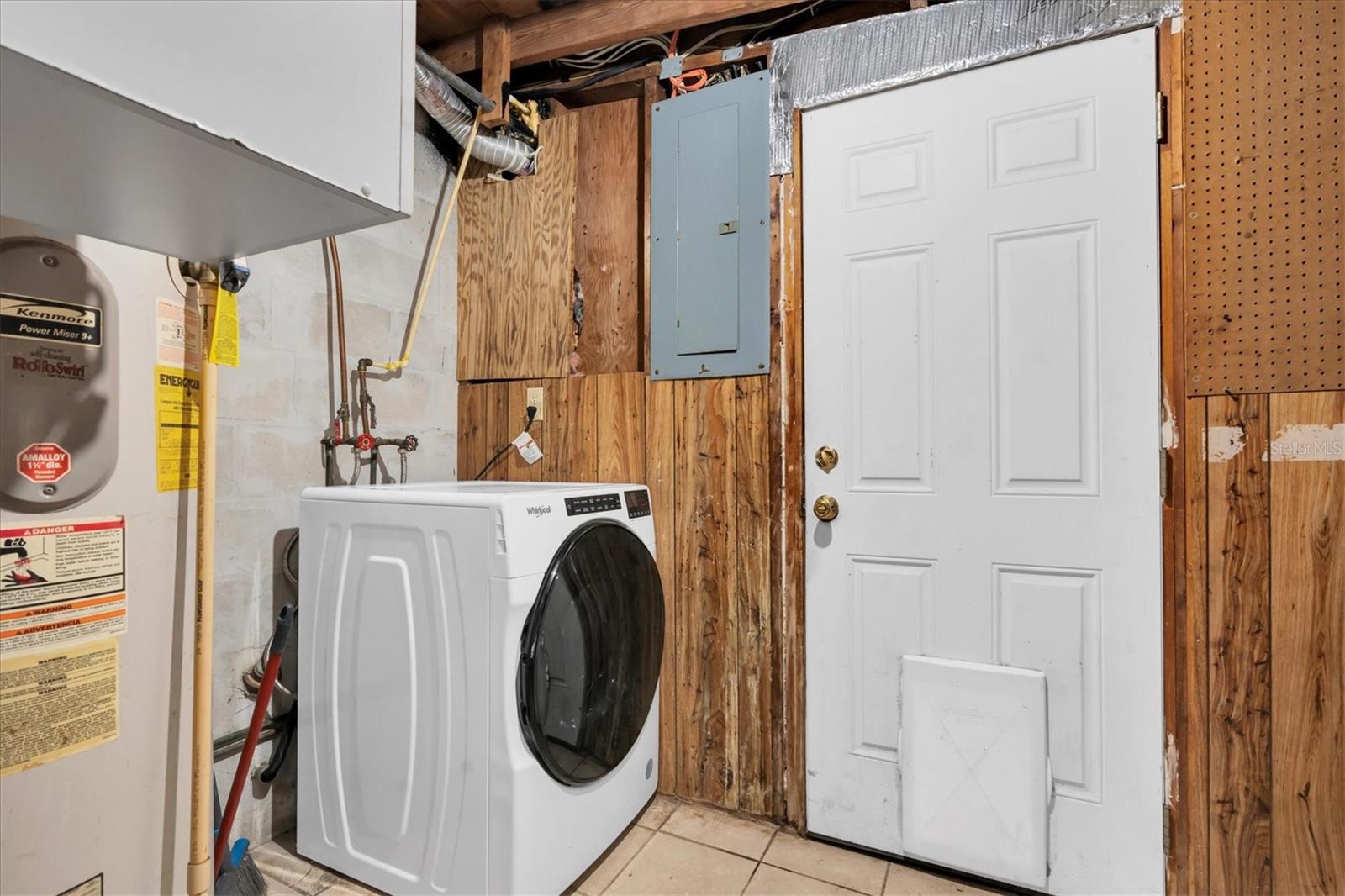 Laundry room located at the rear of the home.