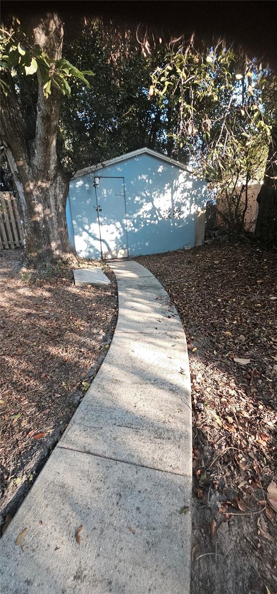 Large (21x20 sq ft) garge with lots... of room for parking all those toys beyond the gated fence. Roof recently replaced on the garage.