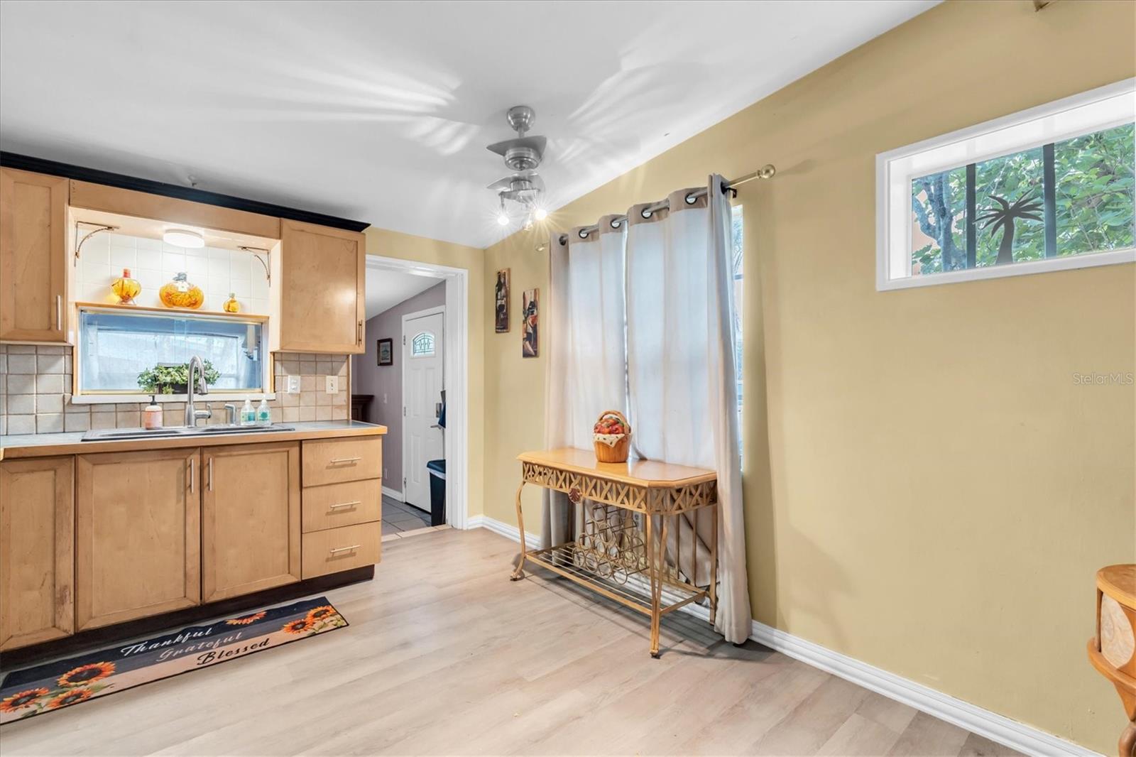 Front door, dining room or can be used as a Fla room to the left.