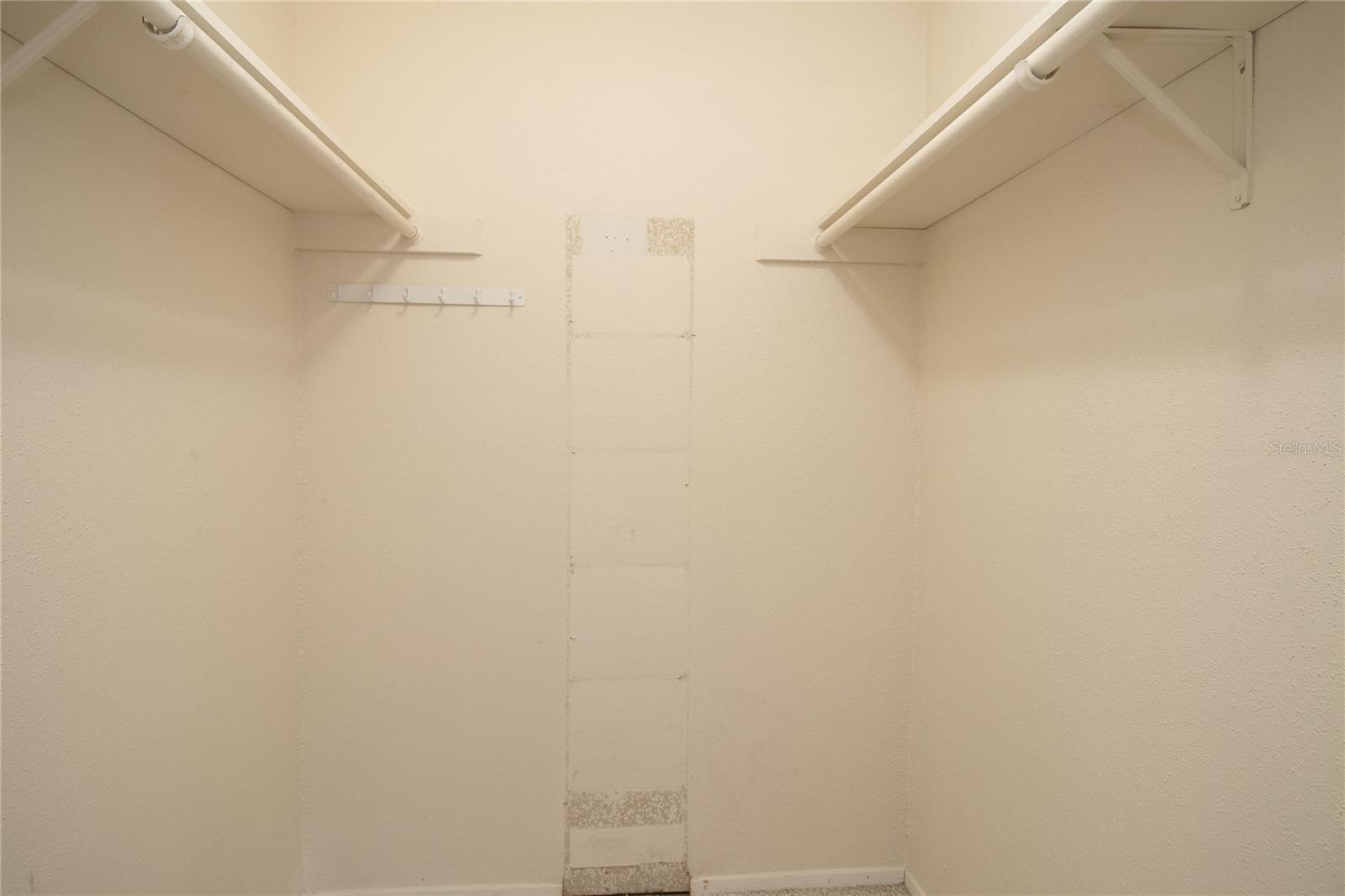 Walk in closet, primary bedroom