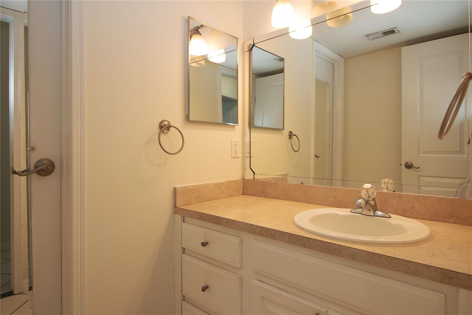 Divided bathroom space for guest convenience