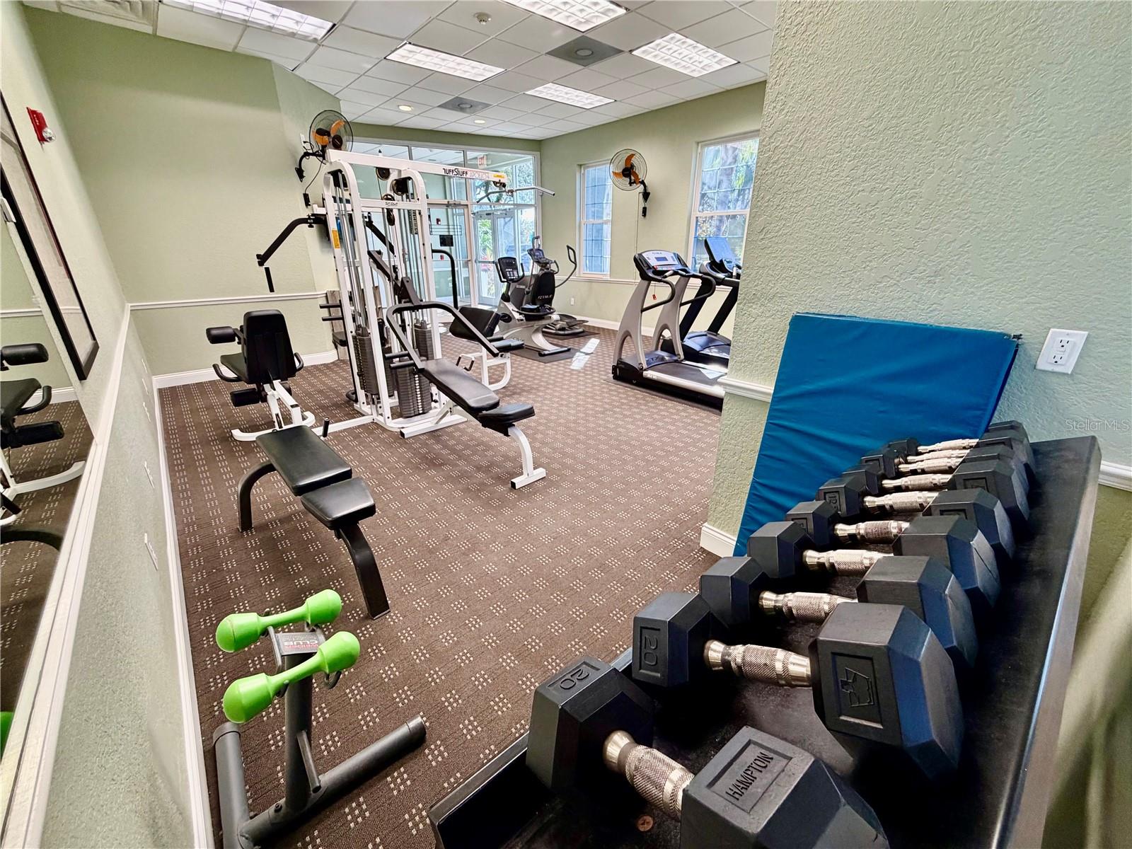Community fitness room with cardio and weight equipment