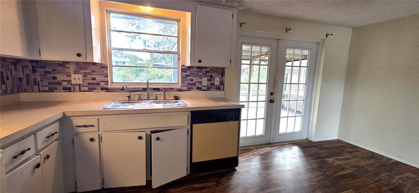 Kitchen with French Doors out to Covered/Screened Lanai