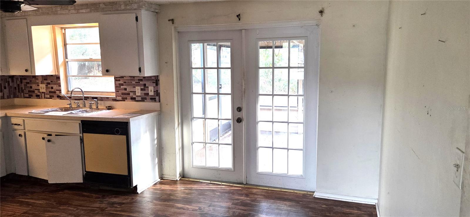 Kitchen with French Doors out to Covered/Screened Lanai