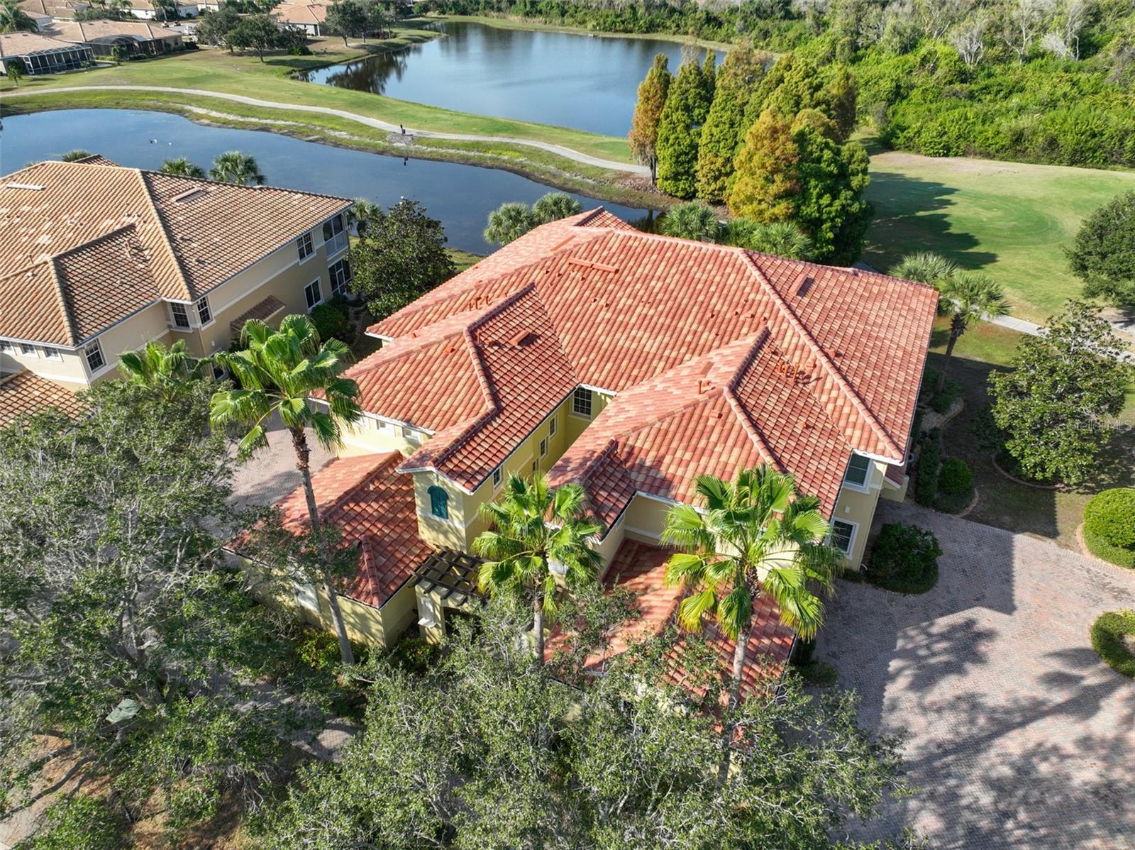 Brand new tile roof. TRIFECTA VIEW: Water, golf course, and conservation. No neighbors in your backyard except the wildlife!