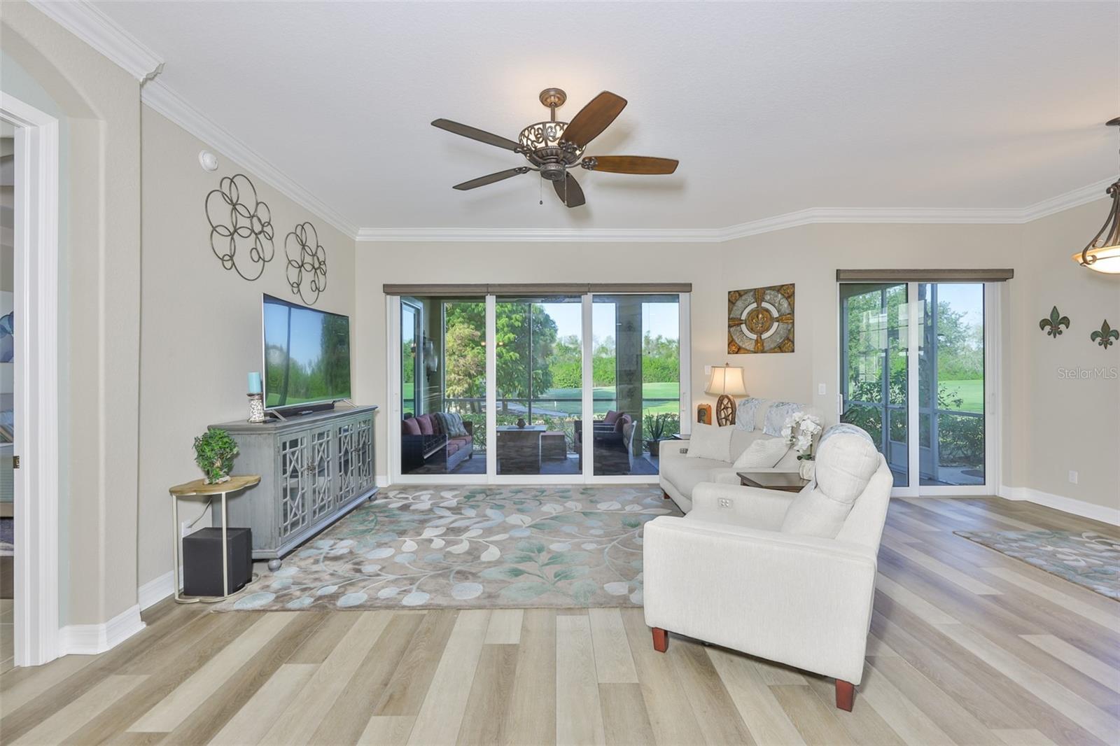 Crown molding throughout the living area focuses on the thought and quality put into the unit.  High-end, rechargeable, battery operated shades are on all of the sliding glass doors and windows in the living area for easy living and maximum privacy.