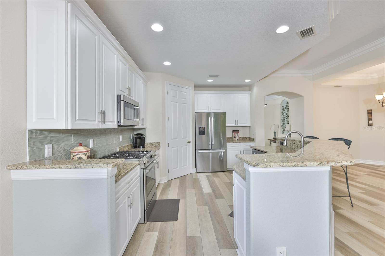 The continuous flooring compliment the space and give a cohesive feel to the entire room.