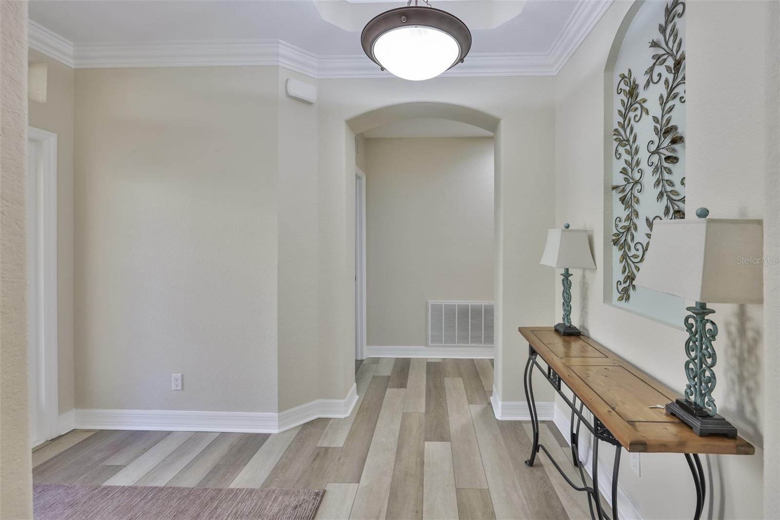 Luxury vinyl, waterproof flooring and architectural features are just a few of the things you will love about this home.