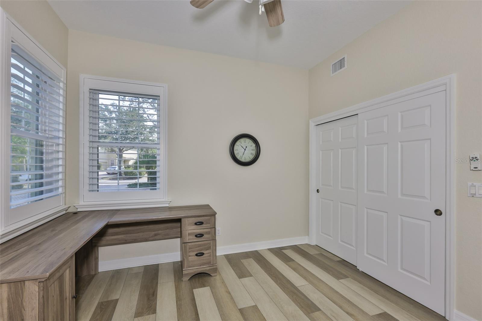 A double closet adds lots of valuable storage to the room.