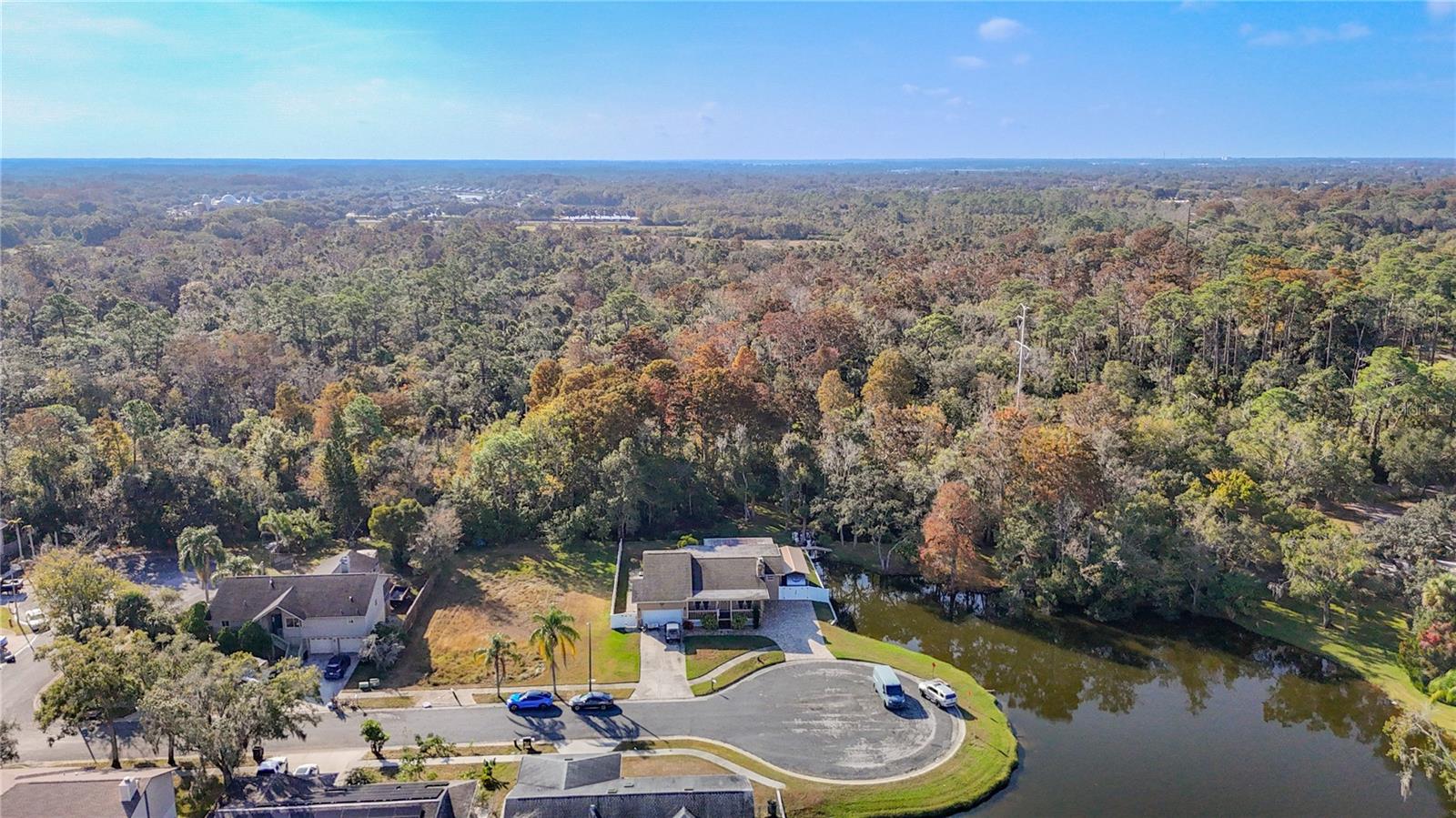 No neighbors behind, an unbuildable lot to the left, the pond to the right. Sweet