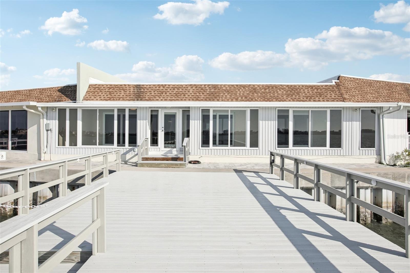 Rear view of Villa's Florida Room from spacious dock.