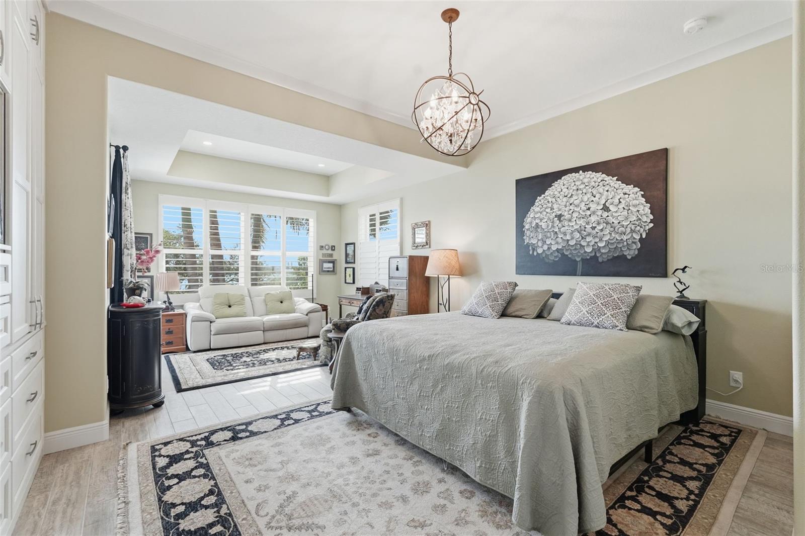 Master bedroom with a sitting area and beautiful views.