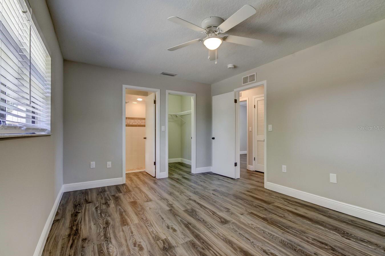 Master Bedroom with in suite bathroom and walk-in closet
