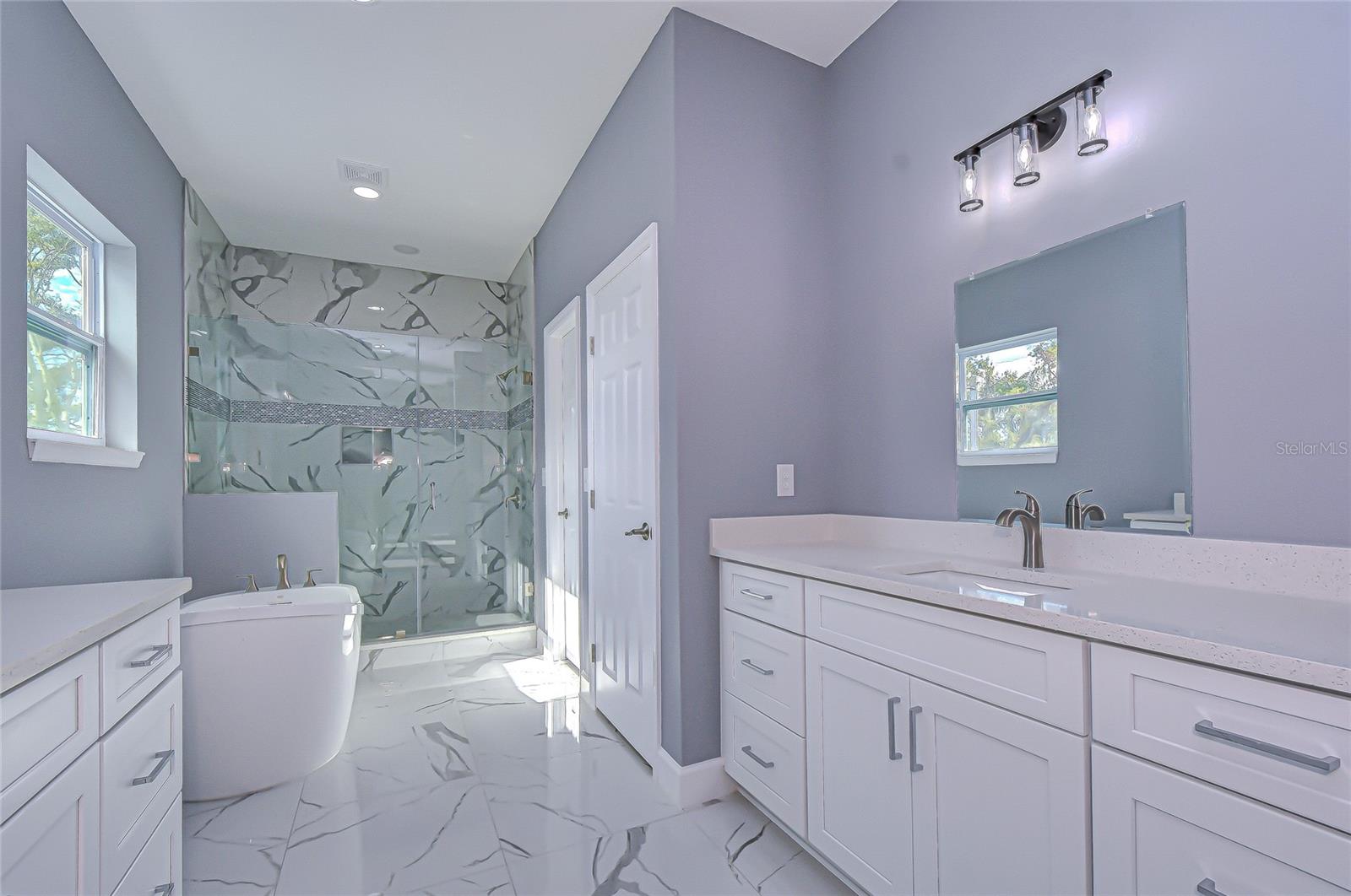 Primary bath w/ similar finishes
