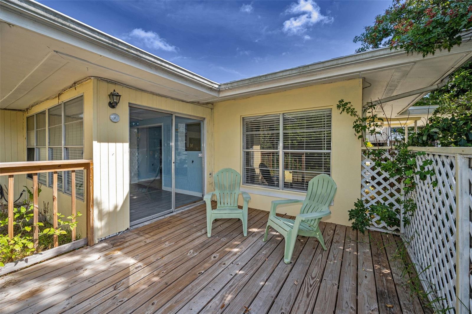Relax on the private newer deck overlooking fenced back yard