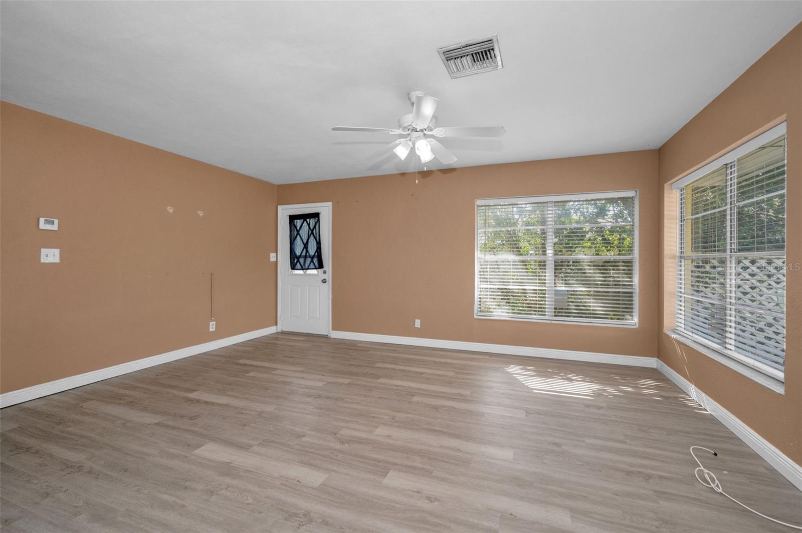 Spacious Living Room/Dining Room with new Laminate flooring.