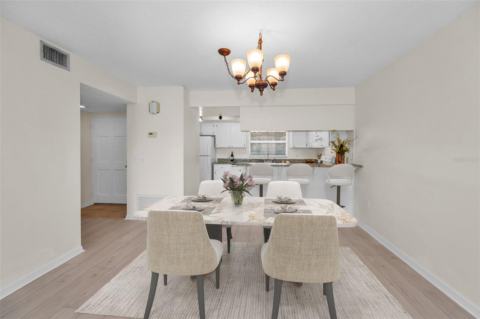 Dining Area with Partial View of Front Entry Hall