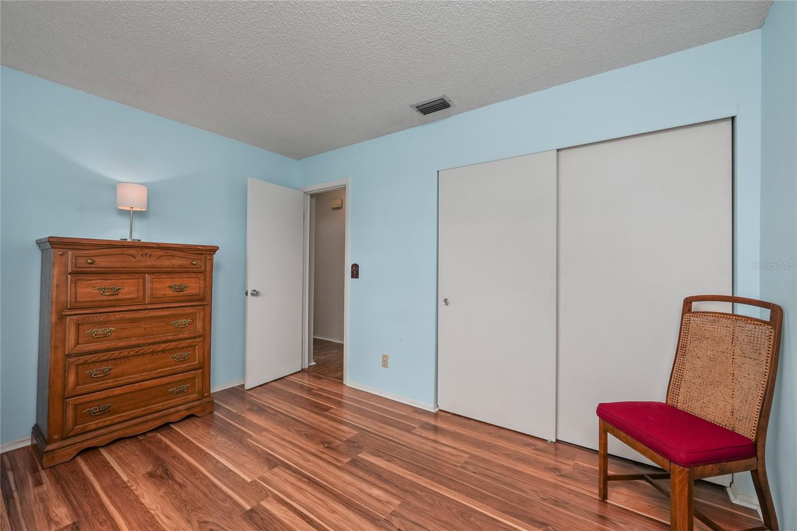 The guest bedroom has a built in closet.